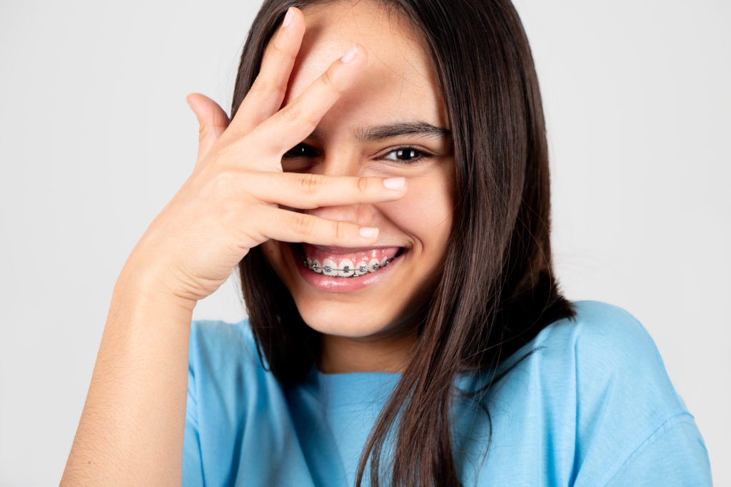 Teen Wearing Braces and Happy